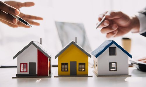 Real estate agent and customer signing contract to buy house, insurance or loan real estate.rent a house,get insurance or loan real estate or property.